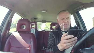 Car Driver Using Smartphone For Email Internet And Driving Car