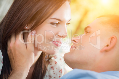Happy Mixed Race Romantic Couple Portrait in the Park.