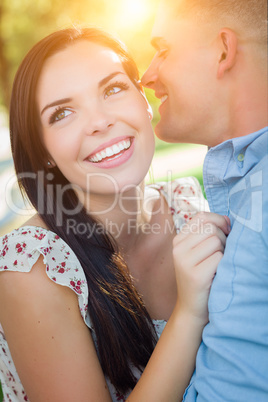 Happy Mixed Race Romantic Couple Portrait in the Park.