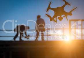 Silhouette of Unmanned Aircraft System (UAV) Quadcopter Drone In