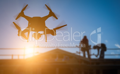 Silhouette of Unmanned Aircraft System (UAV) Quadcopter Drone In