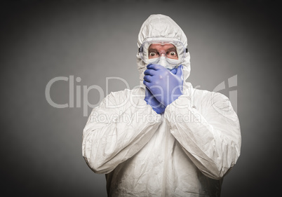 Man Covering Mouth With Hands Wearing HAZMAT Protective Clothing