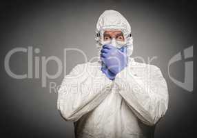 Man Covering Mouth With Hands Wearing HAZMAT Protective Clothing