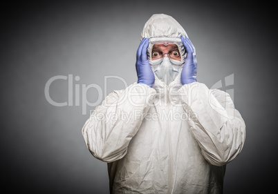 Man Holding Head With Hands Wearing HAZMAT Protective Clothing A
