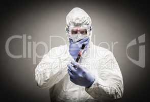 Man Wearing HAZMAT Protective Clothing Holding Test Tube Filled
