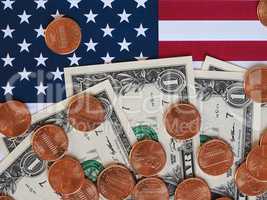 Dollar notes and coins and flag of the United States