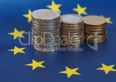 Euro coins, European Union, over flag