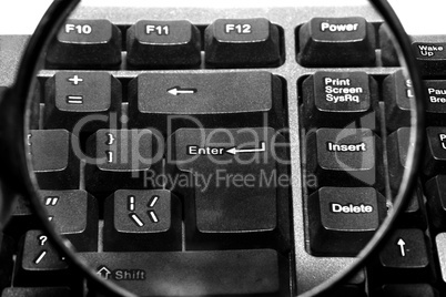 Computer keyboard with magnifying glass