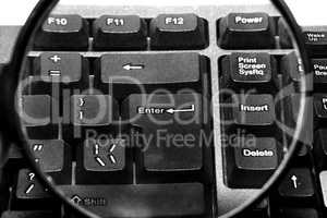 Computer keyboard with magnifying glass