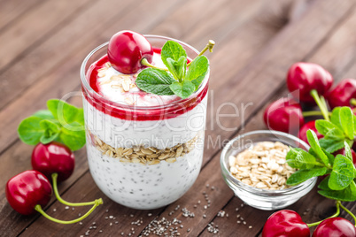 Fresh cherry yogurt with oats and chia seeds, healthy breakfast