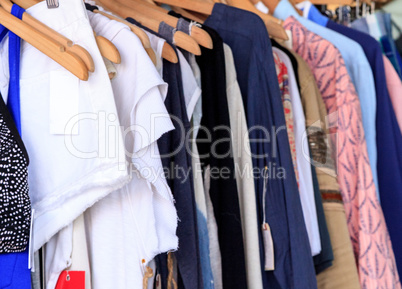 Women?s clothing rack of colorful fabrics