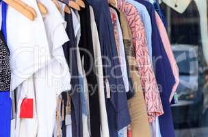 Women?s clothing rack of colorful fabrics