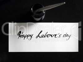 Happy labour's day calligraphy and lattering post card. Top View with calligraph in ink tank