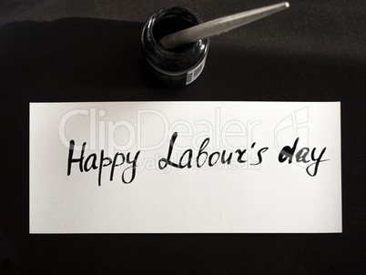 Happy labour's day calligraphy and lattering post card. Top View with calligraph in ink tank