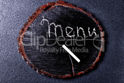 menu inscription in chalk on a wooden blackboard