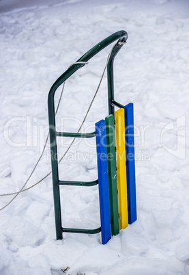 children sleigh in snow