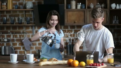 Smiling couple having breakfast in the morning