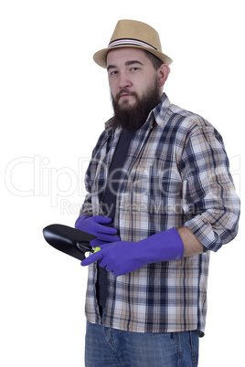 Bearded man with garden tools