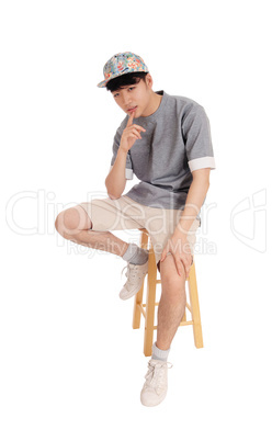 Asian man sitting and thinking.