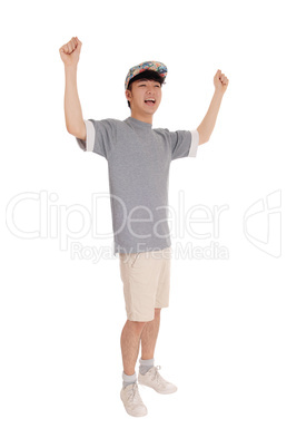 Happy Asian man with arms raised.