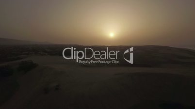 Aerial scene of sand dunes at sunset