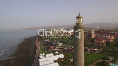 Aerial scene of tourist town and lighthouse. Maspalomas, Gran Canaria
