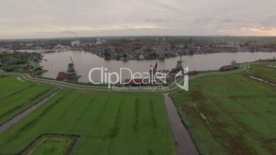 Aerial scene with windmills and township in Netherlands