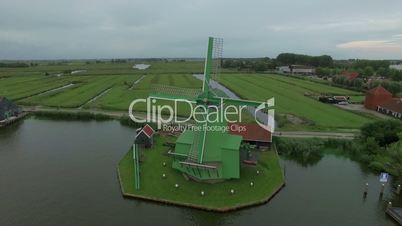 Aerial shot of old windmills and fields in Netherlands