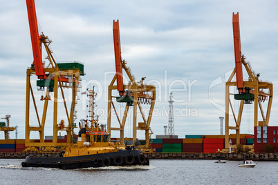 Tug ship in the cargo port