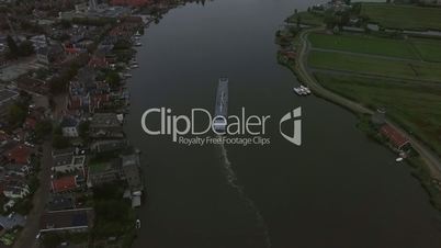 Aerial view of town and river with sailing ship, Netherlands