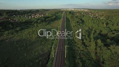 Aerial shot of railway running through the village, Russia