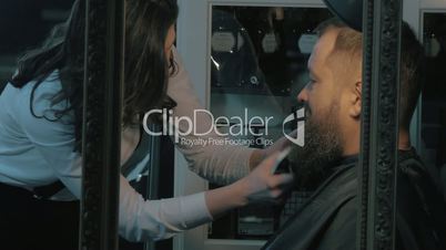 Trimming beard in barbershop