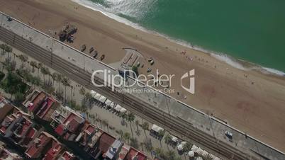 Aerial top view of beach, sea, railways and hotels, Barcelona, Spain