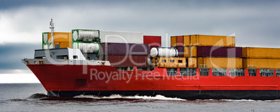 Red cargo container ship's bow