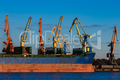 Blue cargo ship loading