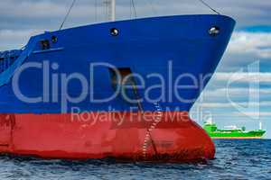 Blue cargo ship moored