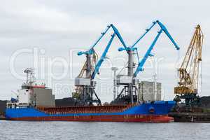 Blue cargo ship loading