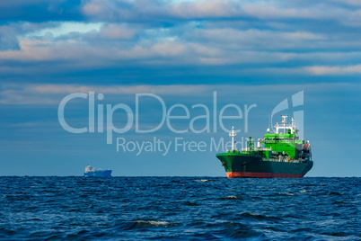 Green cargo ship moored