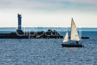 Small sailboat traveling