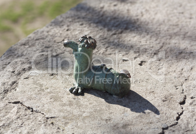 Mini metal sculpture of worm Kukots cartoon character as symbol of fishing photo in Uzhgorod Ukraine