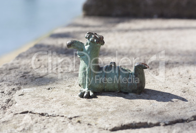 Mini metal sculpture of worm Kukots cartoon character as symbol of fishing photo in Uzhgorod Ukraine