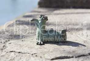 Mini metal sculpture of worm Kukots cartoon character as symbol of fishing photo in Uzhgorod Ukraine