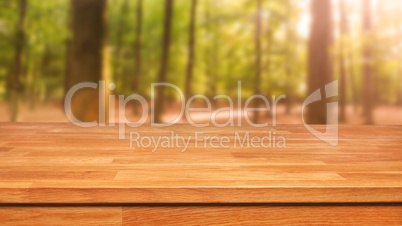 Wooden table with out of focus trees