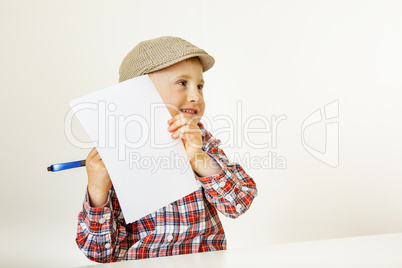 Child with paper and pen