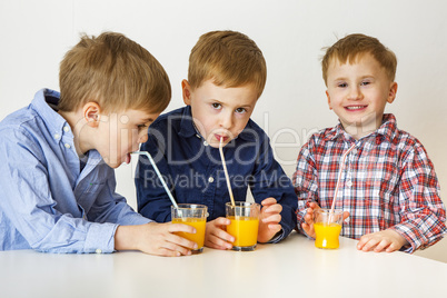 Children drinking fruit juice