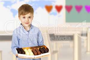 Boy with box of confectionery