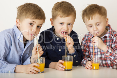 Children drinking fruit juice