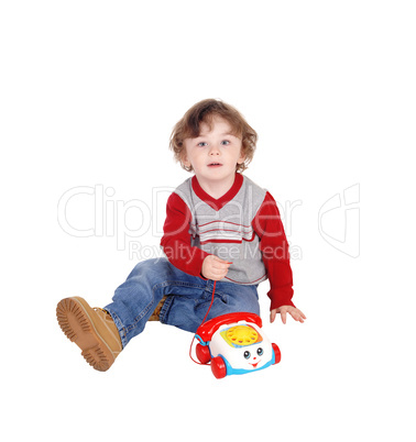Portrait of little boy with his toy phone.