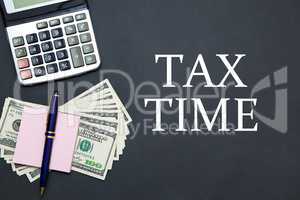 Calculator and Dollars with message TAX TIME