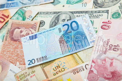 Background from paper money of the different countries. European euro in the middle